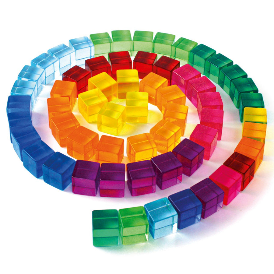 Colourful transparent building blocks arranged in a circular pattern on a white background