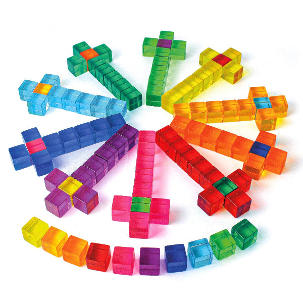 Colorful plastic building blocks arranged in a circular pattern on a white background